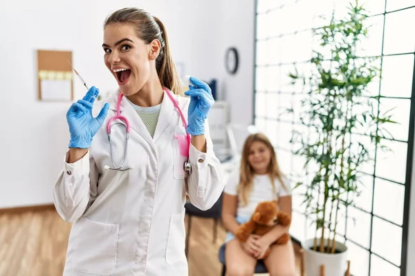 Young Doctor Woman Putting Vaccine Little Girl Celebrating Crazy Amazed — Stockfoto
