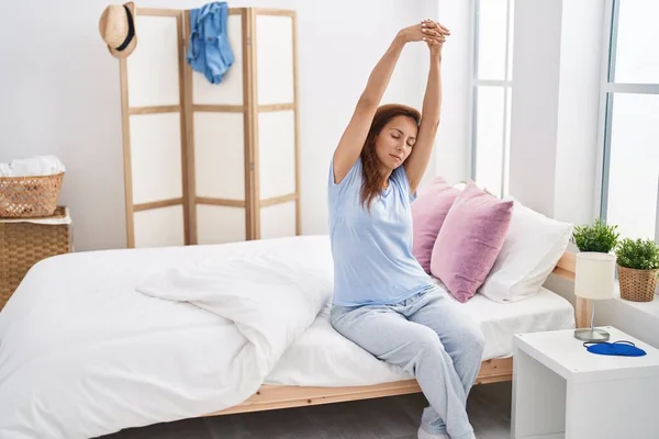 Young Woman Stretching Arms Sitting Bed Bedroom — 스톡 사진