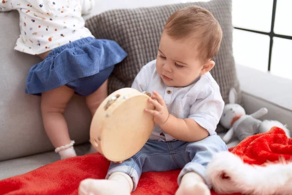 Adorable Toddler Sitting Sofa Christmas Hat Playing Tambourine Home — Stock Photo, Image