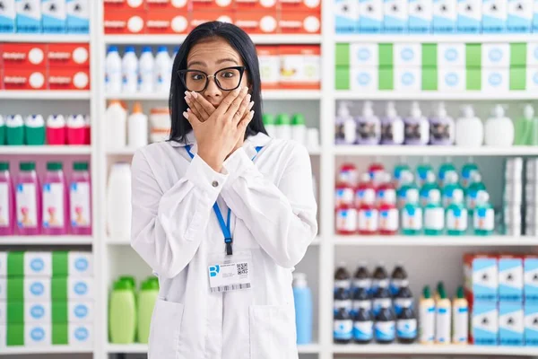 Hispanic Woman Working Pharmacy Drugstore Shocked Covering Mouth Hands Mistake — Foto de Stock
