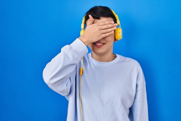 Non Binary Person Listening Music Using Headphones Smiling Laughing Hand — Foto de Stock