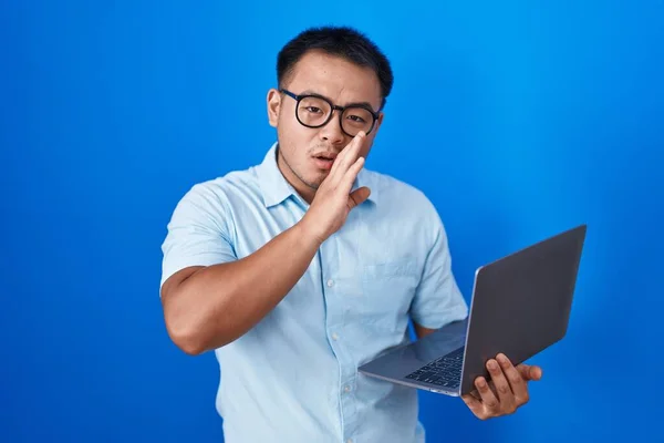 Chinese Young Man Using Computer Laptop Hand Mouth Telling Secret — Stok fotoğraf