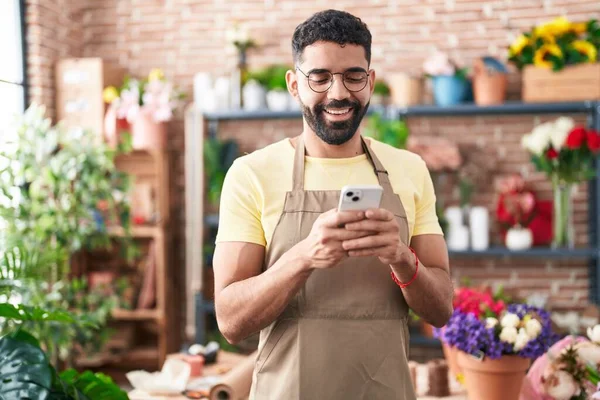 Young Arab Man Florist Smiling Confident Using Smartphone Florist —  Fotos de Stock