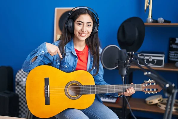Young Teenager Girl Playing Classic Guitar Music Studio Smiling Happy — ストック写真