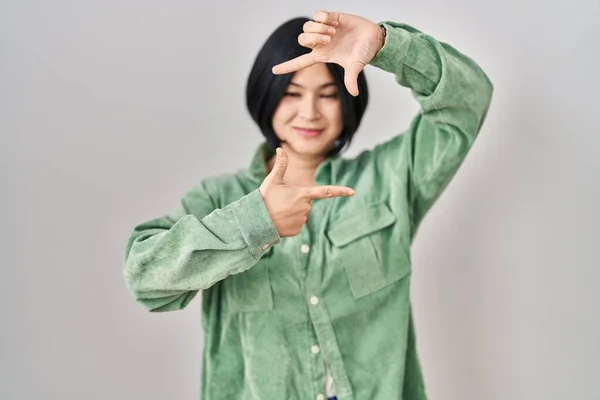 Young Asian Woman Standing White Background Smiling Making Frame Hands — Stock Photo, Image