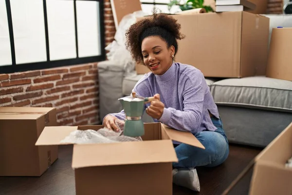 Young African American Woman Smiling Confident Unpacking Coffee Maker New — Stock Photo, Image