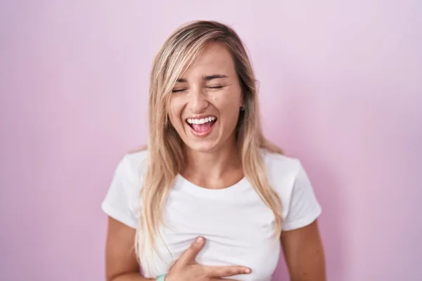 Young Blonde Woman Standing Pink Background Smiling Laughing Hard Out — kuvapankkivalokuva