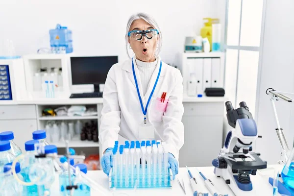 Middle Age Grey Haired Woman Wearing Scientist Uniform Scared Amazed — Stock Photo, Image