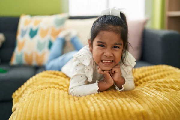 Adorable Hispanic Girl Smiling Confident Lying Sofa Home — Stok fotoğraf