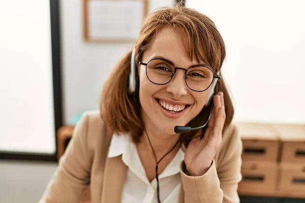 Young caucasian call center agent woman smiling happy working at the office.