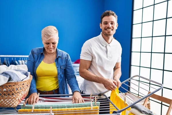 Mother Son Smiling Confident Hanging Clothes Clothesline Laundry Room — Stockfoto