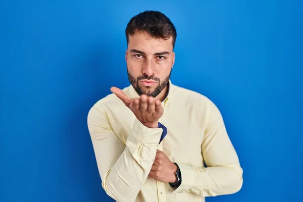 Handsome Hispanic Man Standing Blue Background Looking Camera Blowing Kiss — Foto Stock