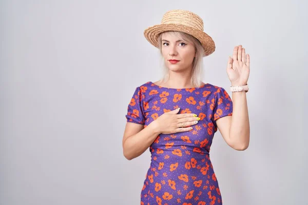 Young Caucasian Woman Wearing Flowers Dress Summer Hat Swearing Hand —  Fotos de Stock