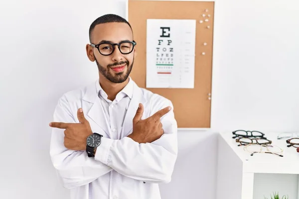 African American Optician Man Standing Eyesight Test Pointing Both Sides — Stockfoto