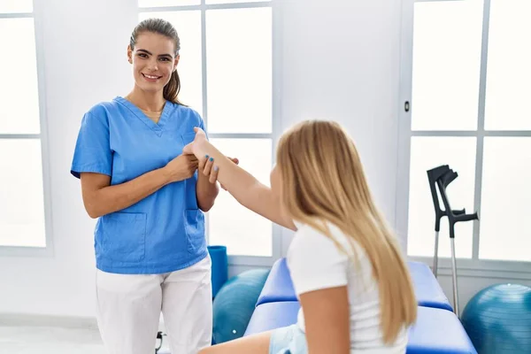 Woman Girl Physiotherapist Patient Having Rehab Session Stretching Hand Physiotherapy — Stockfoto