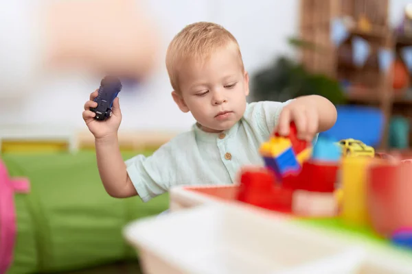Adorable Toddler Playing Construction Blocks Holding Car Kindergarten — Stock Photo, Image
