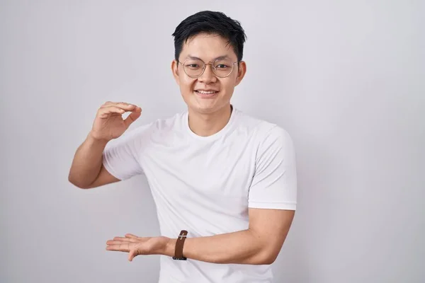 Young Asian Man Standing White Background Gesturing Hands Showing Big — Stockfoto