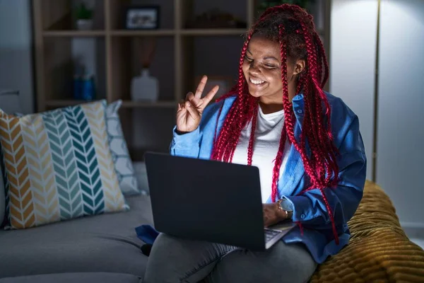 African American Woman Braided Hair Using Computer Laptop Night Smiling —  Fotos de Stock