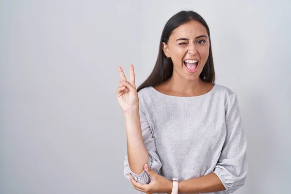 Young Hispanic Woman Standing White Background Smiling Happy Face Winking — Stock Photo, Image