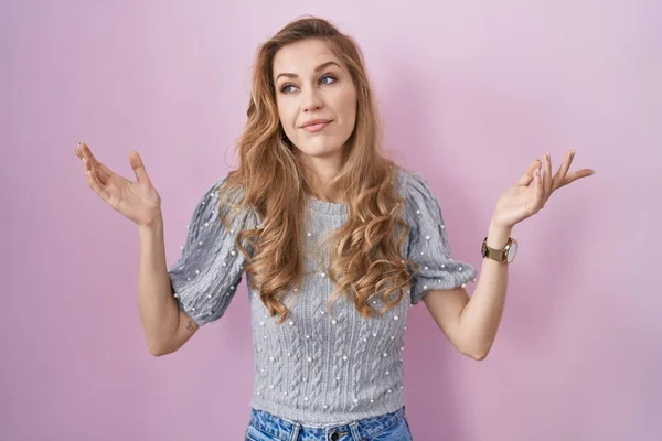 Beautiful Blonde Woman Standing Pink Background Clueless Confused Expression Arms — 图库照片