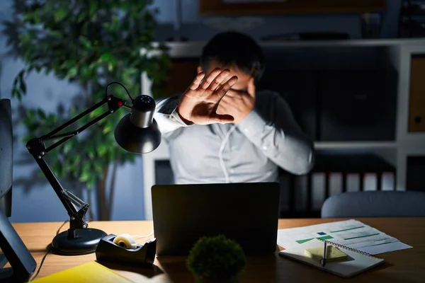 Young Chinese Man Working Using Computer Laptop Night Covering Eyes — Foto Stock