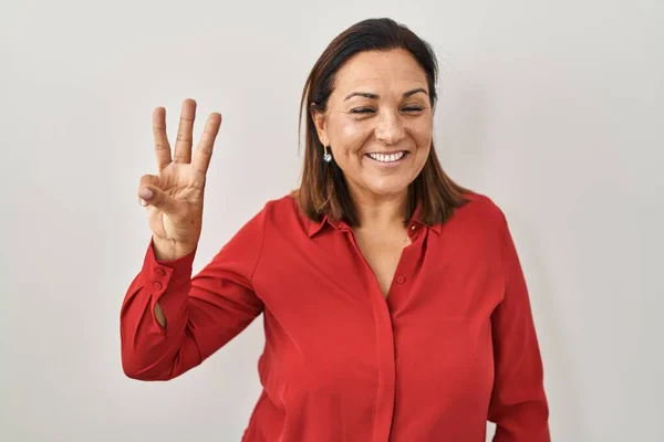 Hispanic Mature Woman Standing White Background Showing Pointing Fingers Number — стоковое фото