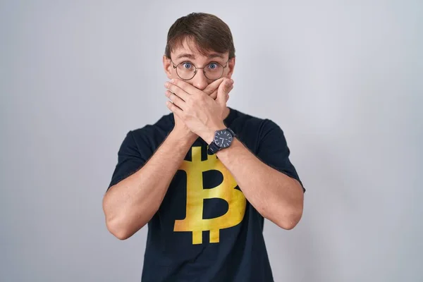 Caucasian Blond Man Wearing Bitcoin Shirt Shocked Covering Mouth Hands — Fotografia de Stock