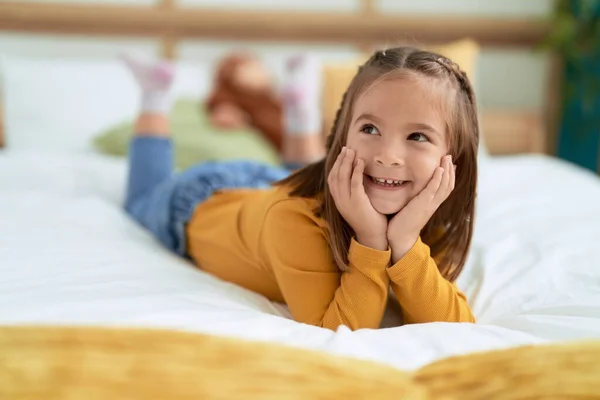Adorable Hispanic Girl Smiling Confident Lying Bed Bedroom — ストック写真