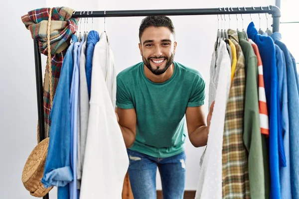 Young Arab Man Customer Smiling Confident Appearing Clothes Rack Clothing — Stock Photo, Image