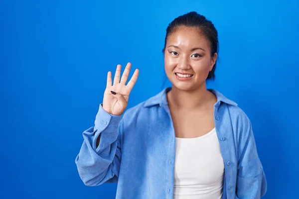 Asian Young Woman Standing Blue Background Showing Pointing Fingers Number — Fotografia de Stock