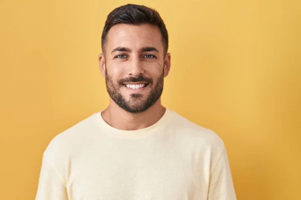 Handsome Hispanic Man Standing Yellow Background Happy Cool Smile Face — Stock Photo, Image