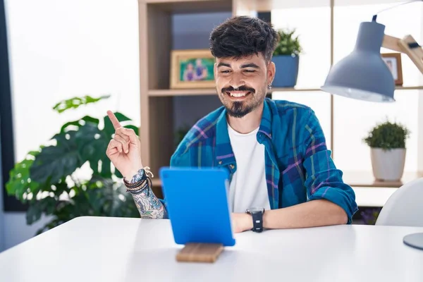 Young Hispanic Man Beard Using Touchpad Sitting Table Smiling Happy — Photo