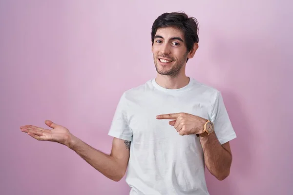 Young Hispanic Man Standing Pink Background Amazed Smiling Camera While — Stockfoto