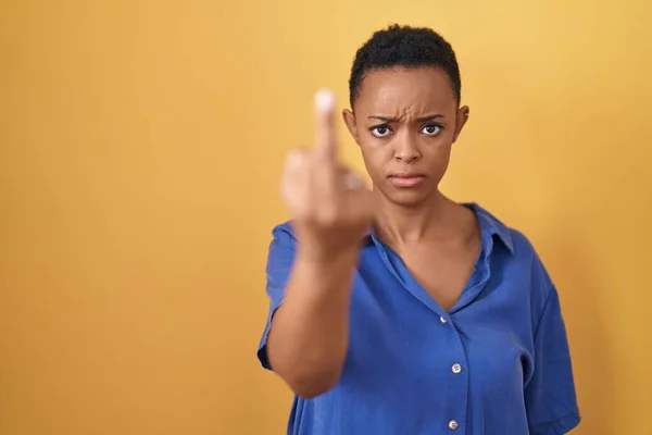 African American Woman Standing Yellow Background Showing Middle Finger Impolite — Stockfoto