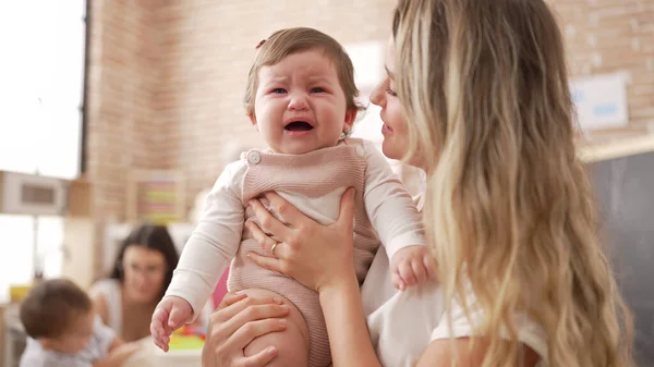 Mother Daughter Consueling Baby Crying Kindergarten — Stock Photo, Image