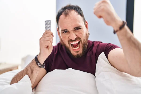 Size Hispanic Man Beard Bed Holding Pills Annoyed Frustrated Shouting — ストック写真