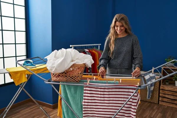 Young Blonde Woman Smiling Confident Hanging Clothes Clothesline Laundry Room — ストック写真