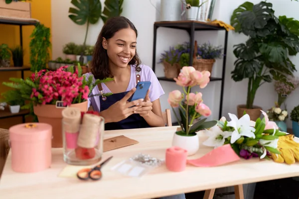 Young African American Woman Florist Smiling Confident Using Smartphone Flower —  Fotos de Stock