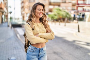 Young woman tourist smiling confident walking at street
