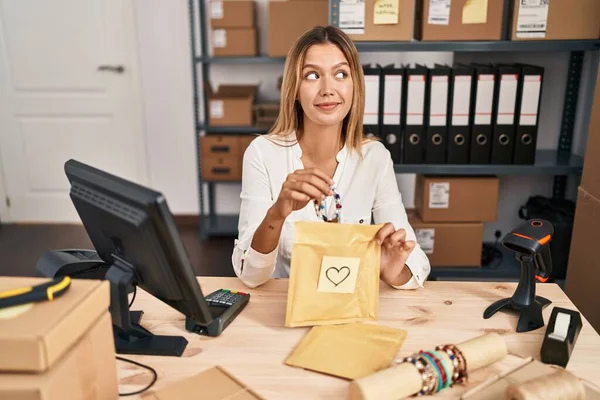 Young Blonde Woman Working Small Business Ecommerce Smiling Looking Side — Stock fotografie