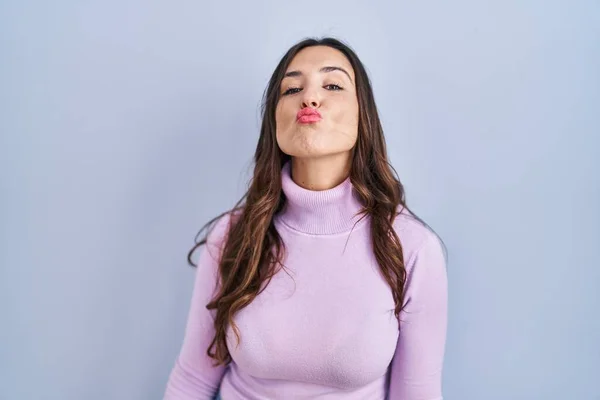 Young Brunette Woman Standing Blue Background Looking Camera Blowing Kiss — Photo