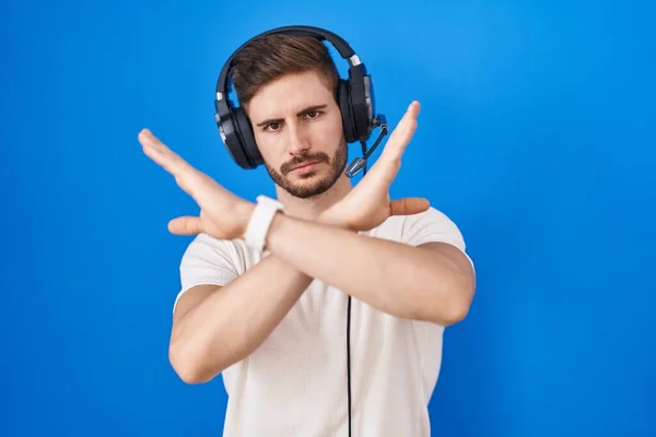 Hispanic Man Beard Listening Music Wearing Headphones Rejection Expression Crossing — Stockfoto