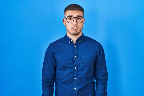 Young Hispanic Man Wearing Glasses Blue Background Depressed Worry Distress — Stock Photo, Image