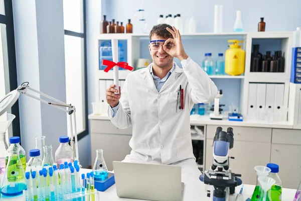 Young Hispanic Man Working Scientist Laboratory Holding Diploma Smiling Happy — Photo