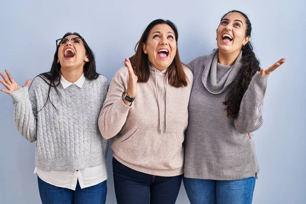 Mother Two Daughters Standing Blue Background Crazy Mad Shouting Yelling — Stock Photo, Image
