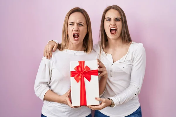 Middle Age Mother Young Daughter Holding Mothers Day Gift Angry — ストック写真