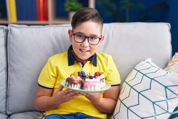 Young Hispanic Kid Holding Cake Sweets Smiling Laughing Hard Out —  Fotos de Stock