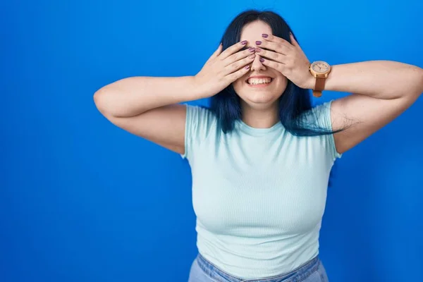 Young Modern Girl Blue Hair Standing Blue Background Covering Eyes — Stockfoto