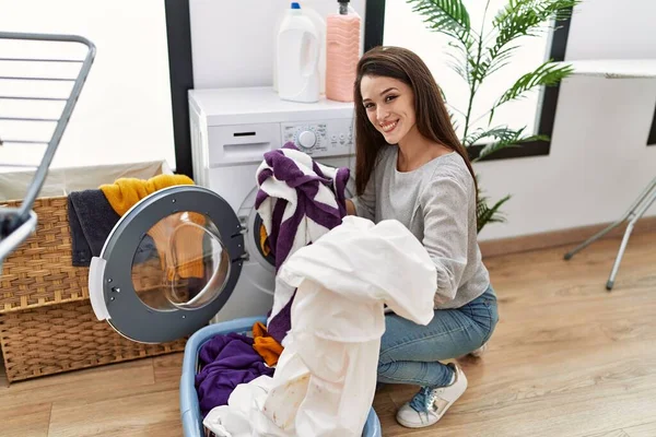 Young Hispanic Woman Smiling Confident Washing Clothes Laundry Room — Stok fotoğraf