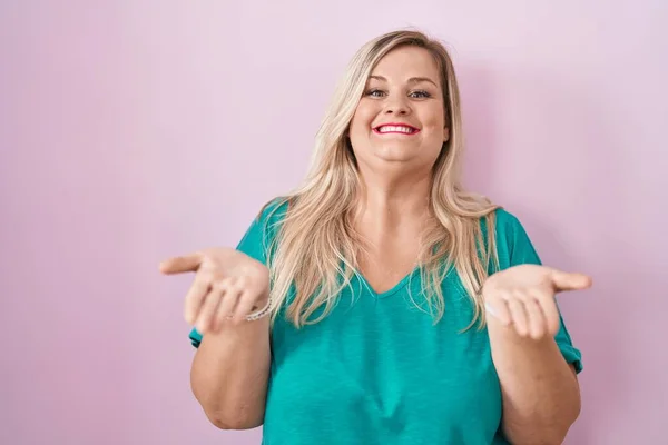 Caucasian Size Woman Standing Pink Background Smiling Cheerful Offering Hands — Zdjęcie stockowe